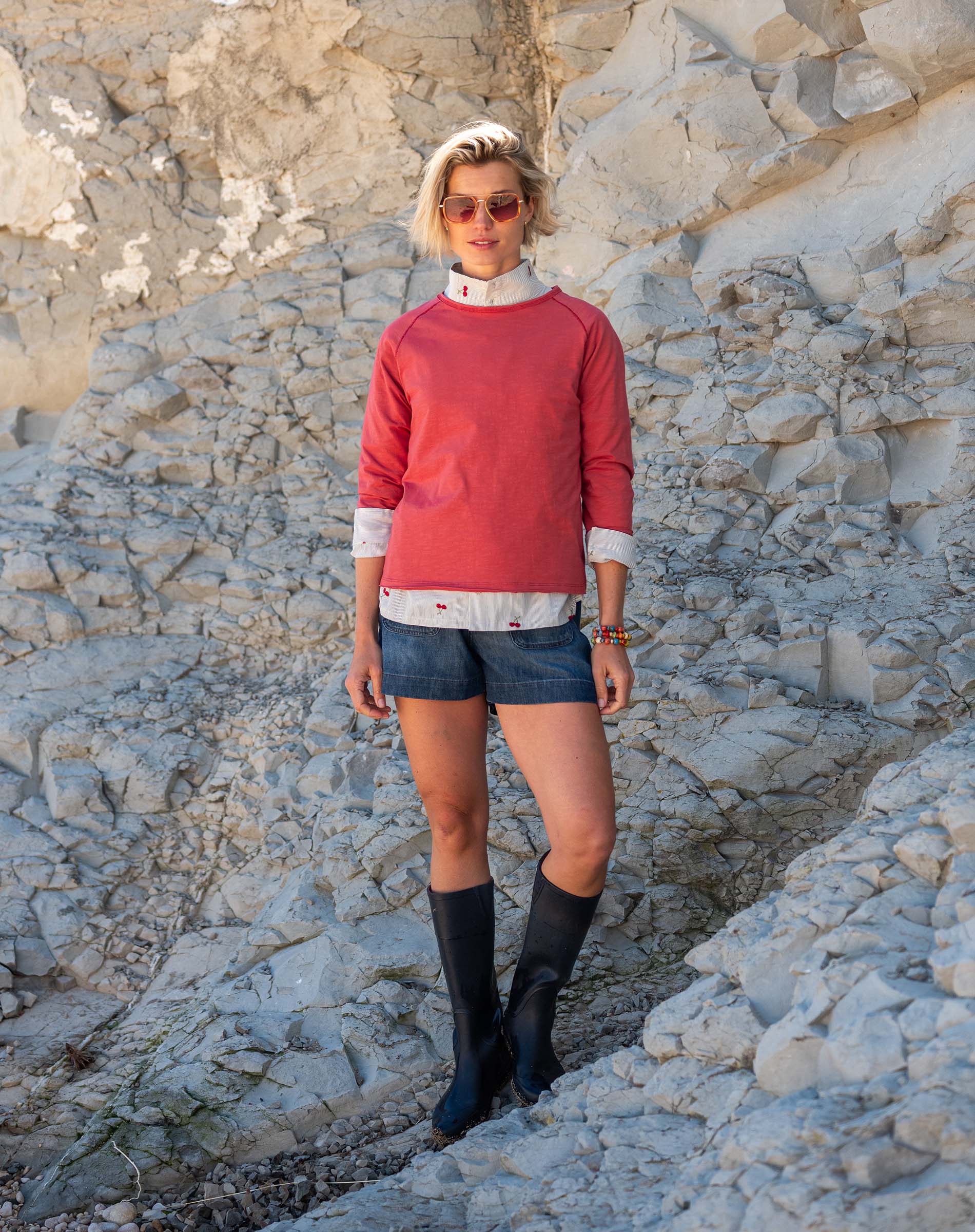 Cayenne red raglan tee with white stripes on the sleeves and collar.