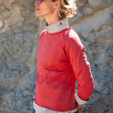 Cayenne red raglan tee with contrast collar and cuffs.