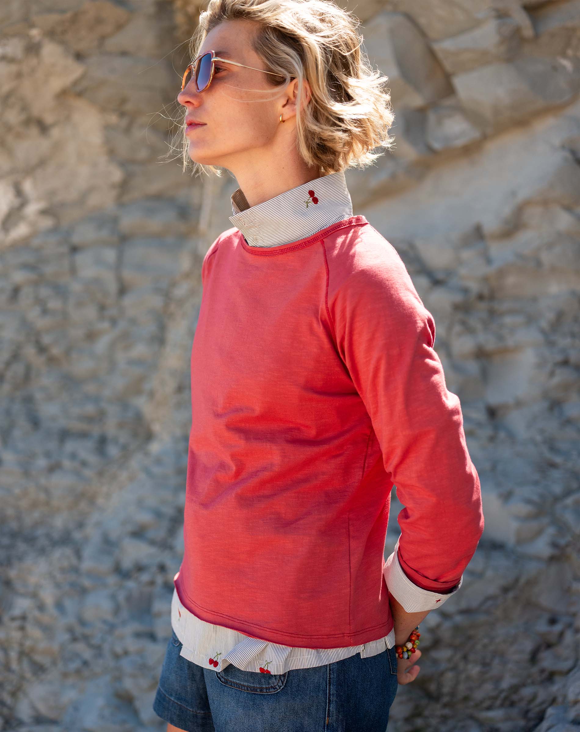 Cayenne red raglan tee with contrast collar and cuffs.