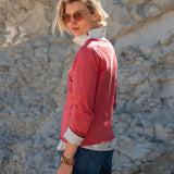 Cayenne red raglan tee with white contrast collar and cuffs.