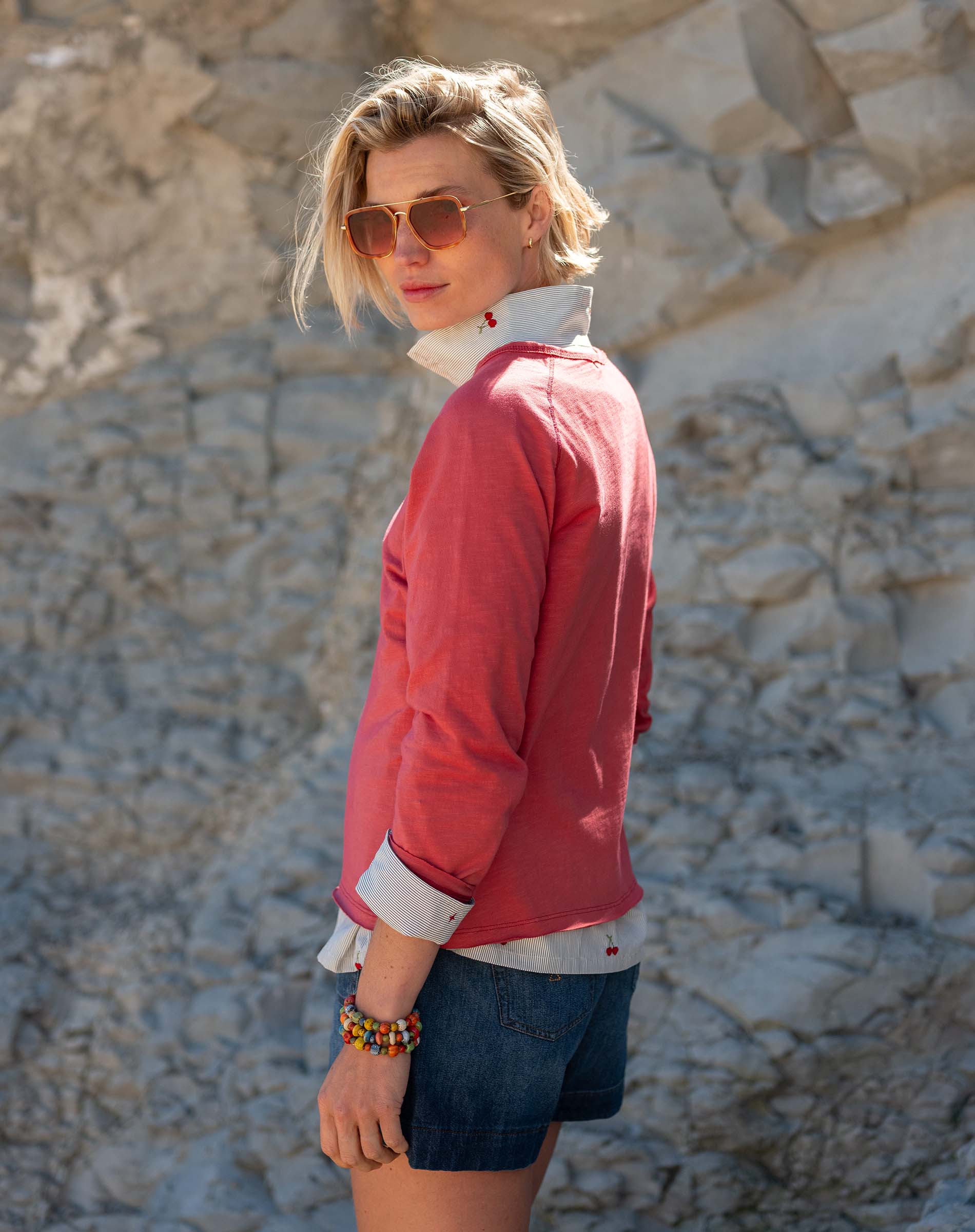 Cayenne red raglan tee with white contrast collar and cuffs.