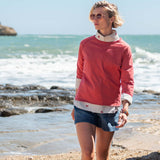 Cayenne red raglan tee with contrasting cream trim and side detail.