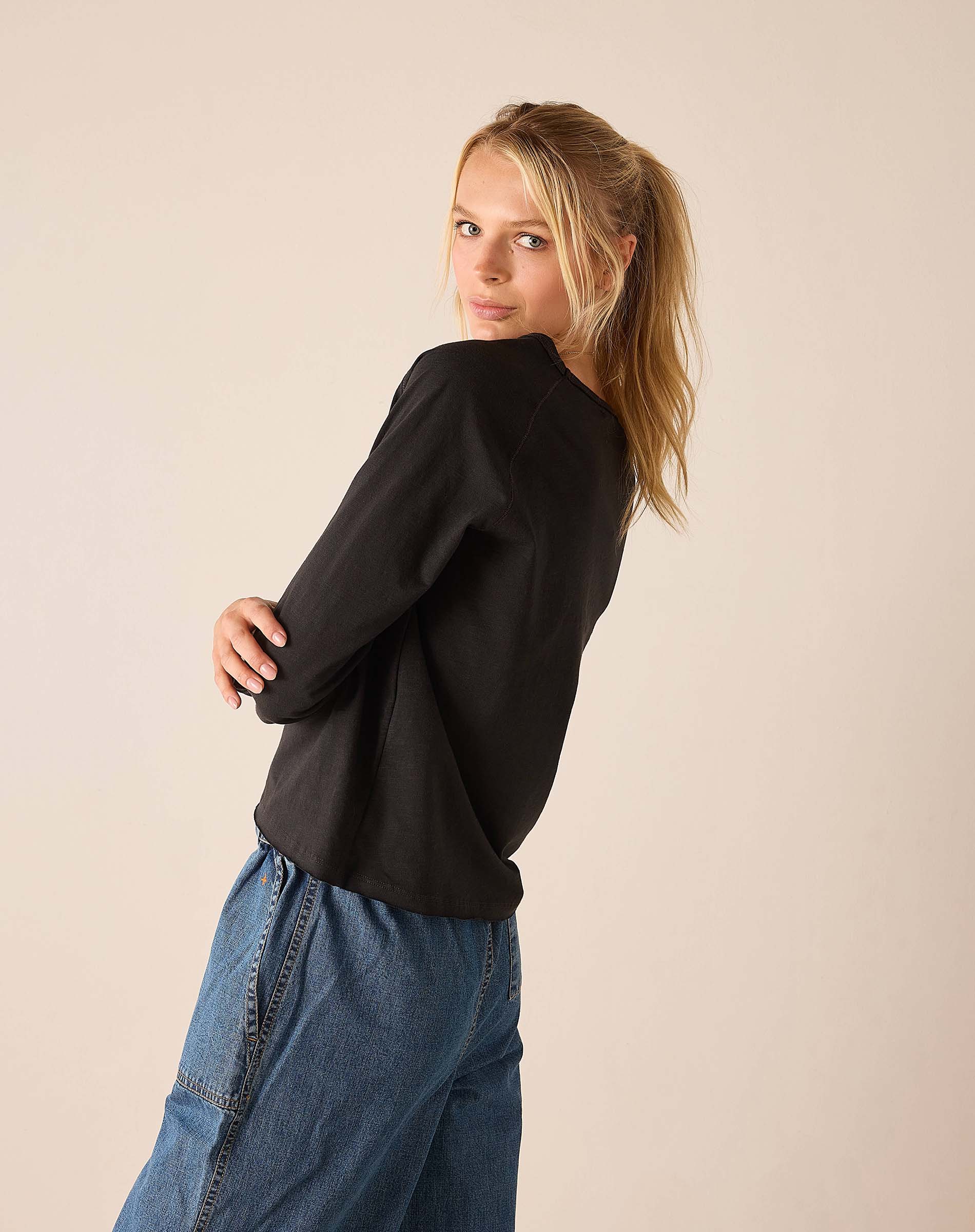 Graphite gray raglan tee with a relaxed fit and soft knit construction.