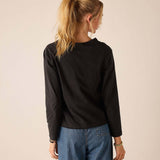 Back view of women's travel-friendly graphite gray raglan tee.