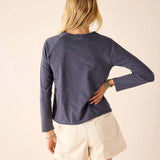 Back view of women's travel-friendly navy blue raglan tee in soft jersey fabric.