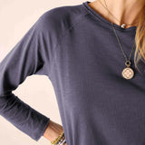 Navy blue raglan tee with a soft knit texture and ribbed neckline.