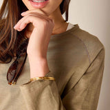 Nutmeg colored raglan tee in a soft cotton blend with dropped shoulders and rolled cuffs.