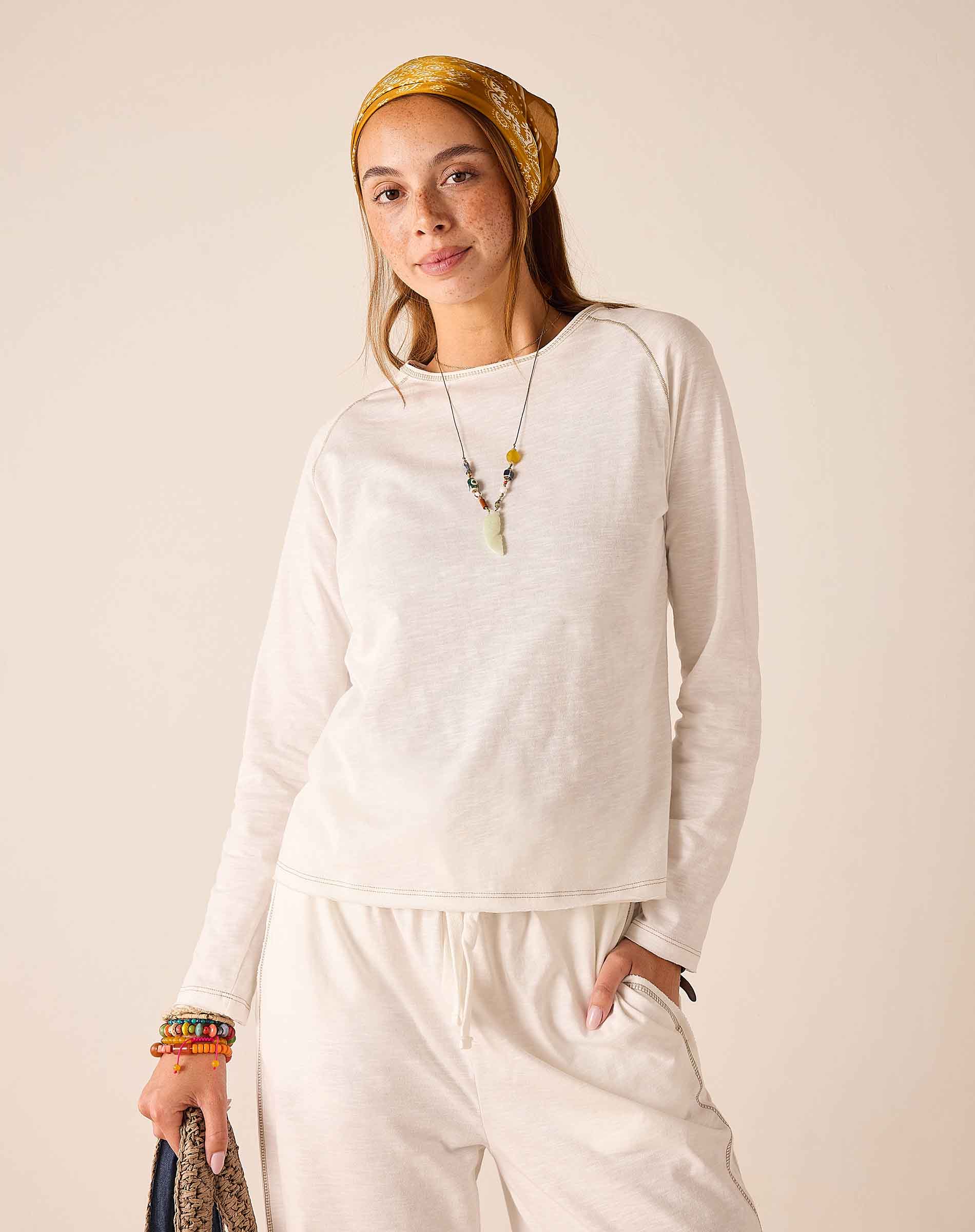 Ladies' travel-ready white raglan tee in a soft knit fabric.