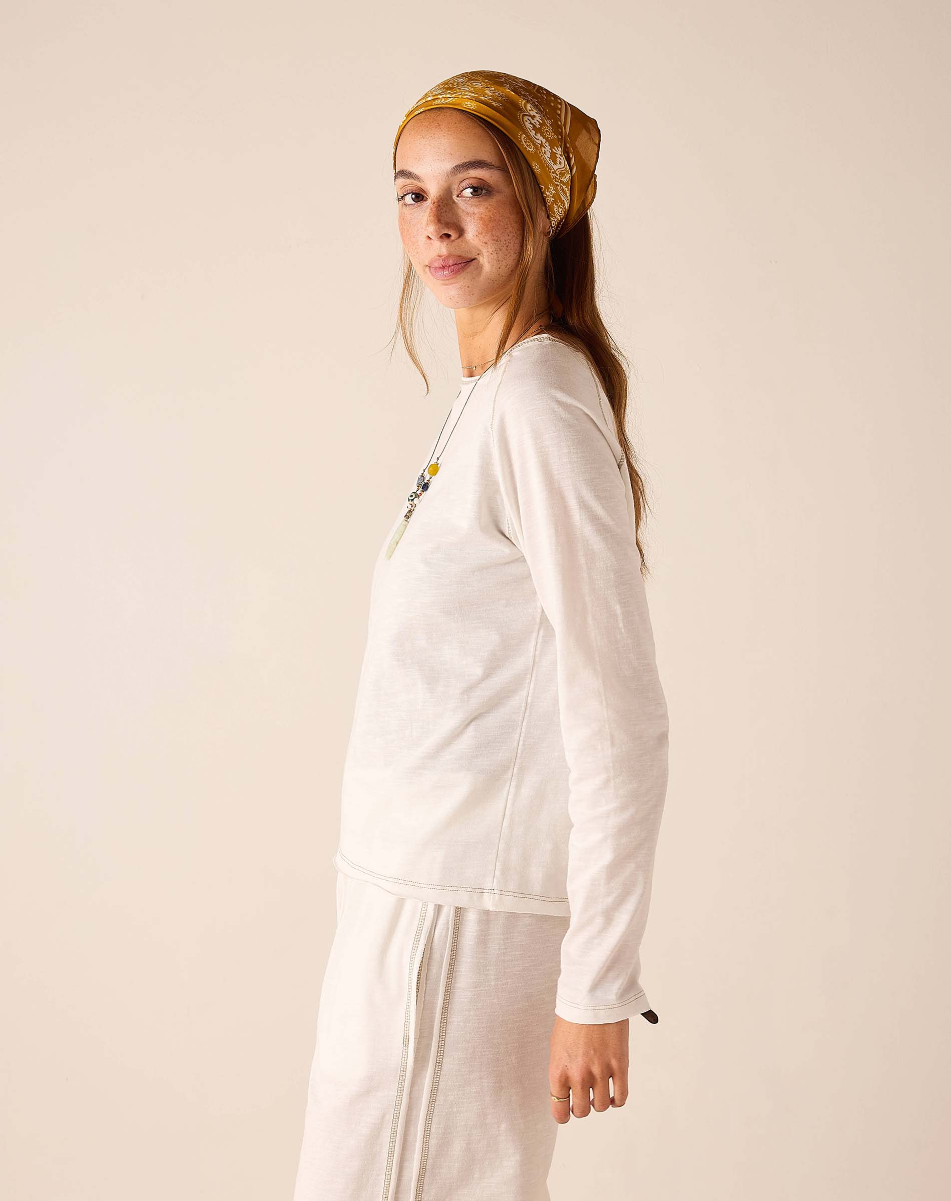 White relaxed fit linen blend raglan tee with drop shoulder detail.