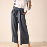 Atlas blue linen-blend wide-leg trousers with an elasticized waistband and ruffled detail.