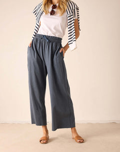 Atlas blue linen-blend wide-leg trousers with an elasticized waistband and ruffled detail.