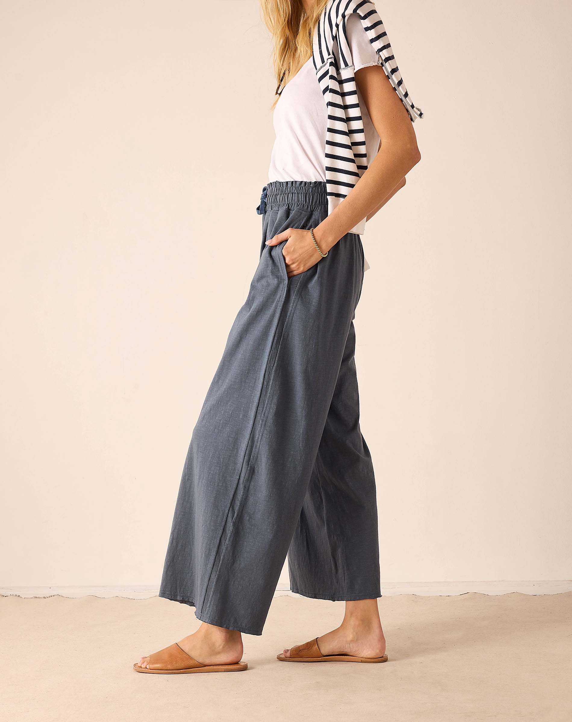 Atlas blue wide-leg relaxed fit linen blend pants featuring a gathered elastic waistband and deep side pockets.