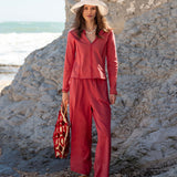 Cayenne red button-front top and matching wide-leg pants set in a soft woven fabric.