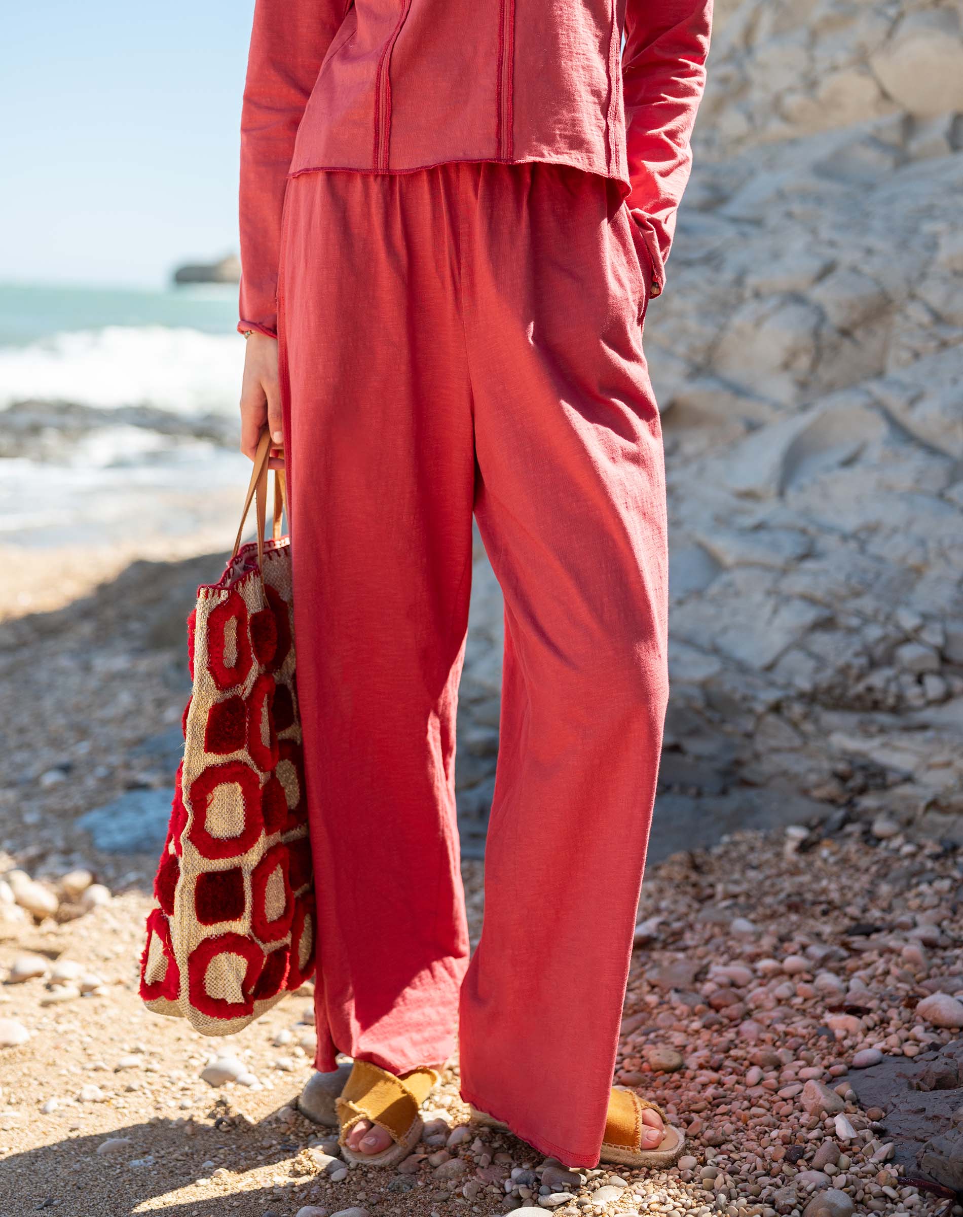 Cayenne red relaxed fit linen blend Trouvaille tee and matching pants set featuring a buttoned front.