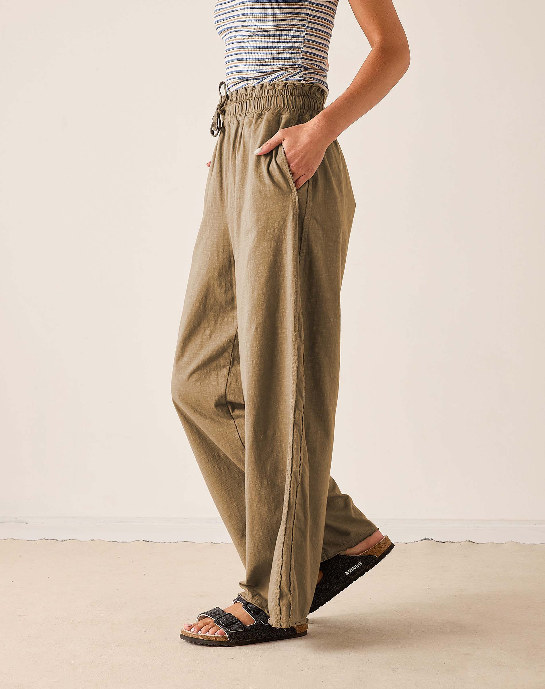 Nutmeg wide-leg trousers in a textured knit fabric with an elasticated waist and drawstring.