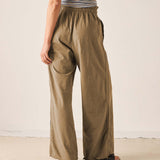 Nutmeg wide-leg linen pants with an elastic waistband and relaxed fit.