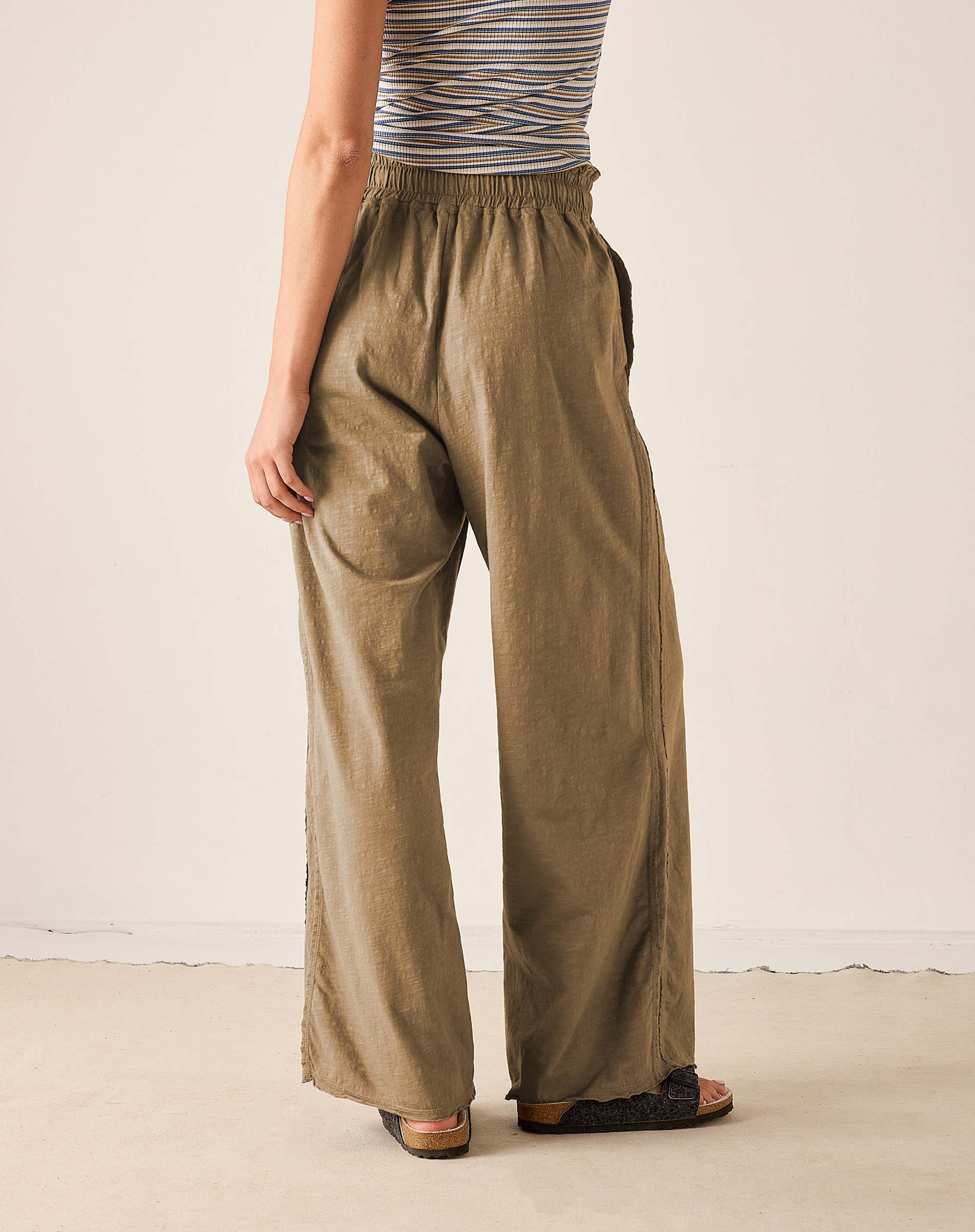 Nutmeg wide-leg linen pants with an elastic waistband and relaxed fit.