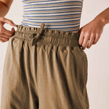 Nutmeg linen blend trousers with a gathered elastic waistband and drawstring detail.
