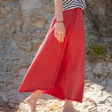 Cayenne red linen maxi skirt with a relaxed fit and gathered waist.