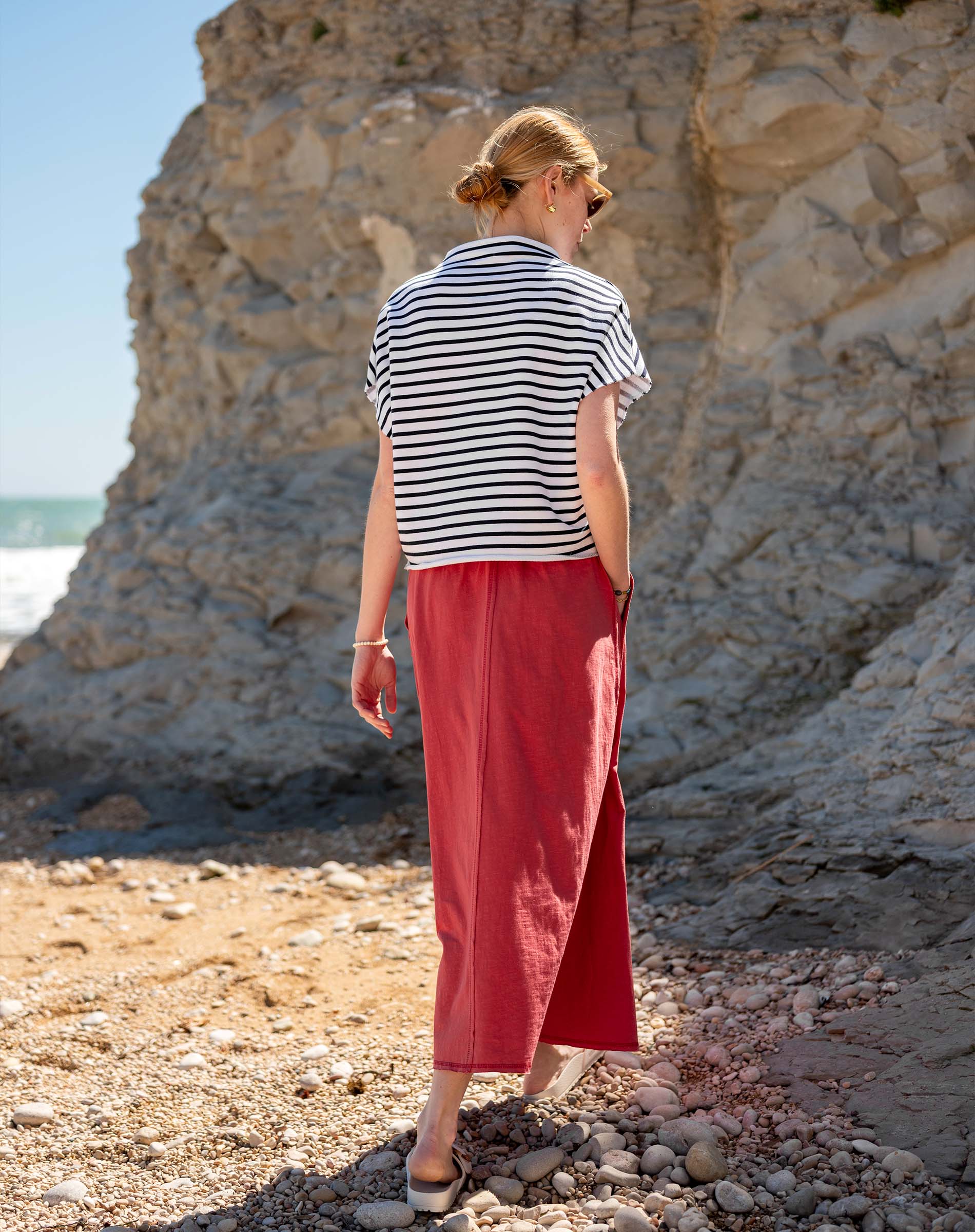 Horizontal striped tee in navy and white paired with a wide-leg cayenne linen skirt.