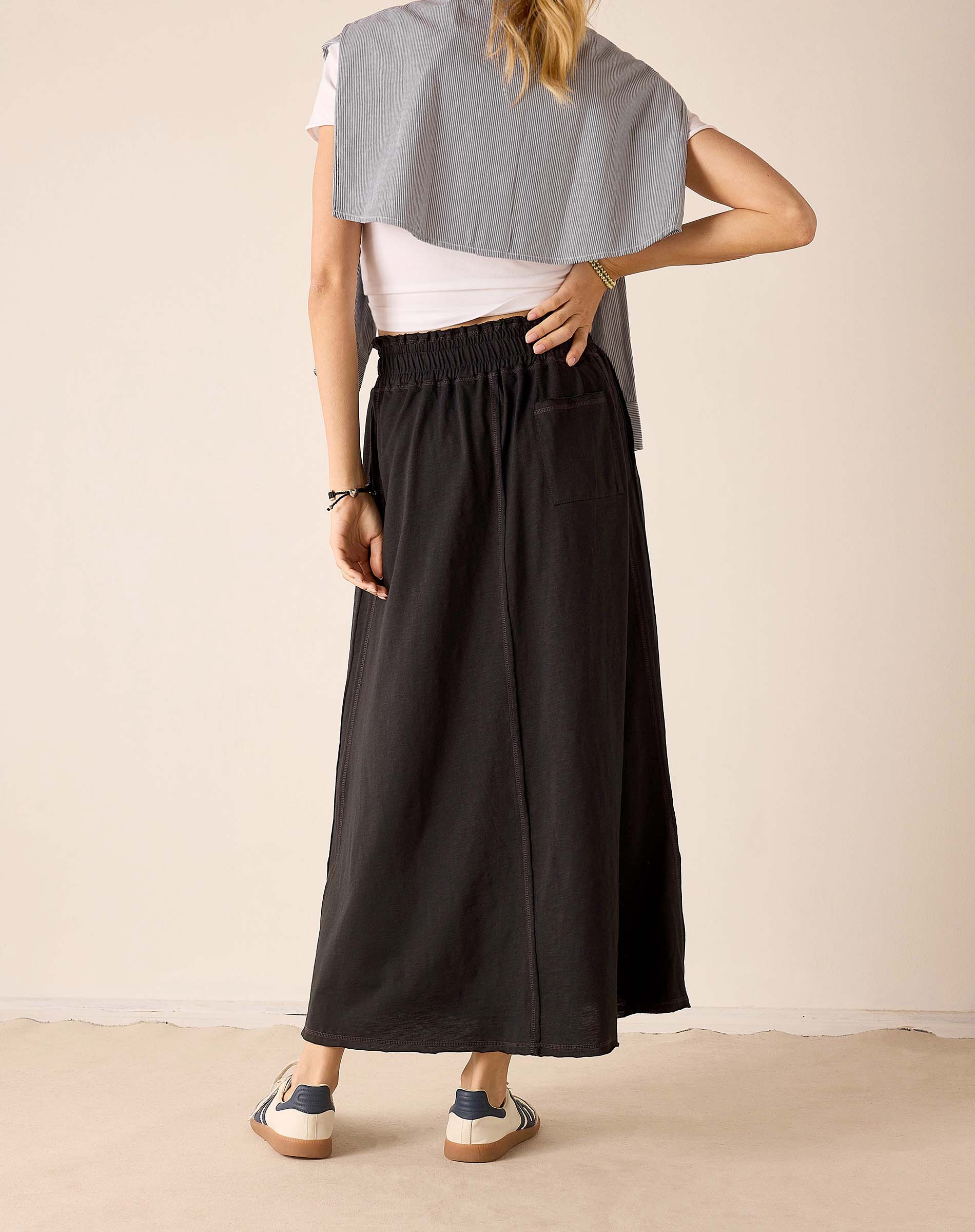 Graphite linen blend maxi skirt with an elasticized waistband and matching grey knit travel wrap draped over a white tee.
