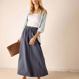 Ladies' travel-ready navy linen maxi skirt with a relaxed fit and elastic waistband.