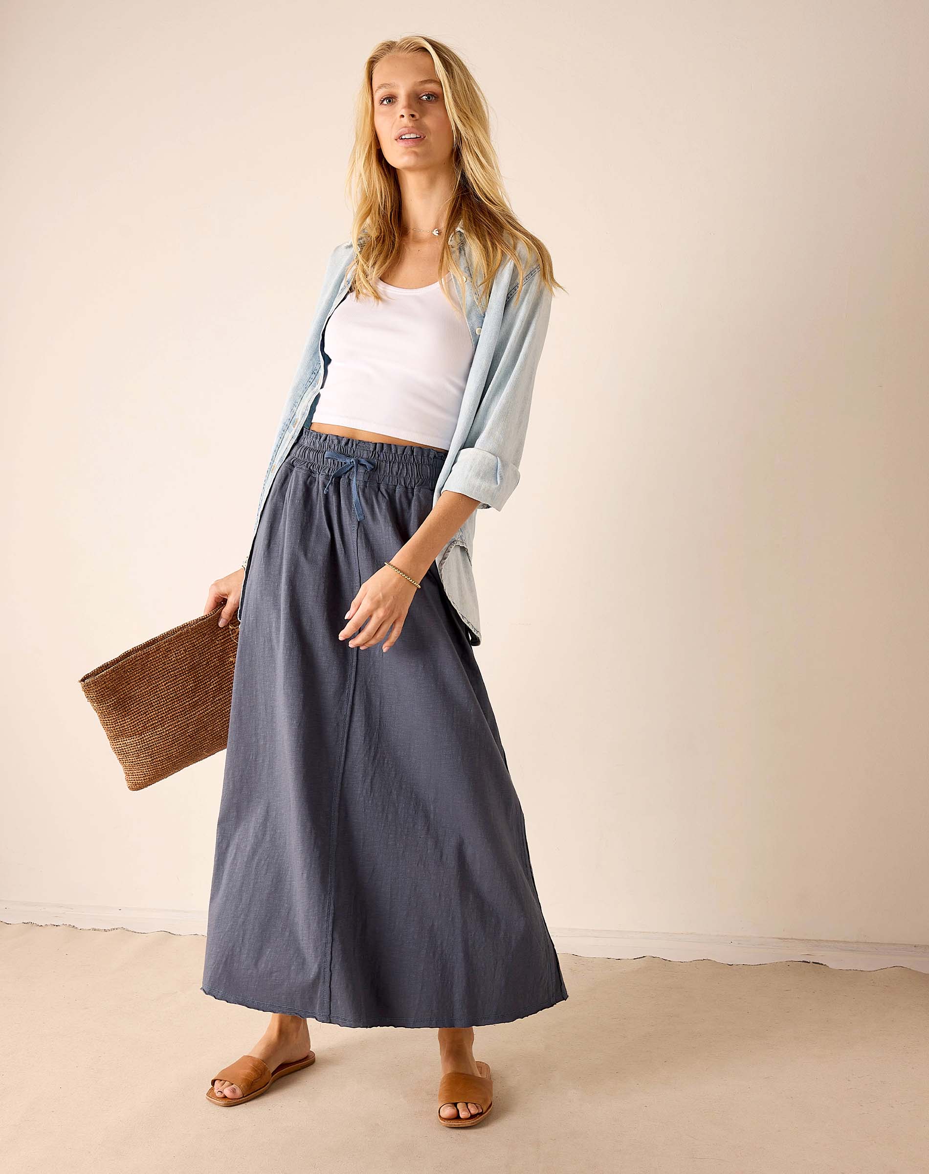 Ladies' travel-ready navy linen maxi skirt with a relaxed fit and elastic waistband.