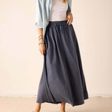 Navy blue linen-blend maxi skirt with a gathered waist and matching tie belt.