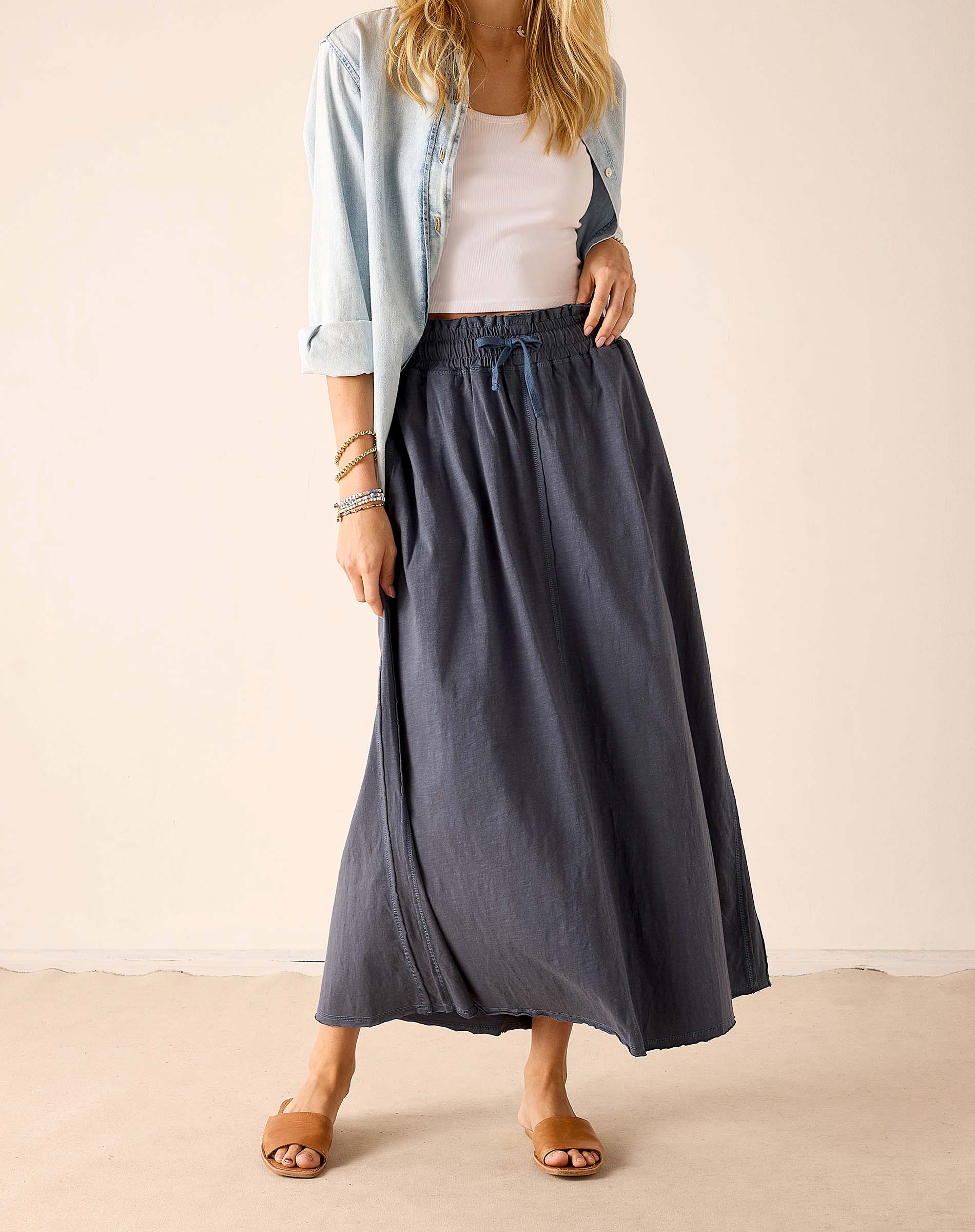 Navy blue linen-blend maxi skirt with a gathered waist and matching tie belt.