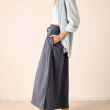 Navy blue oversized linen skirt with a front seam detail.