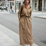 Nutmeg brown linen tee skirt featuring a buttoned front and long length.