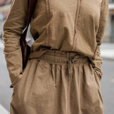 Nutmeg brown linen blend tee and matching skirt with pleated front detail.