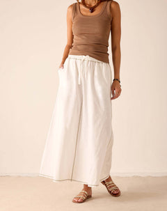 White linen-blend tiered skirt with a drawstring waist and wide hem.