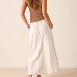 Back view of the white linen maxi skirt with a relaxed fit and side seam detail.