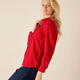 Cardinal red tuxedo ruffle shirt with a textured overlay on the front and gathered cuffs.