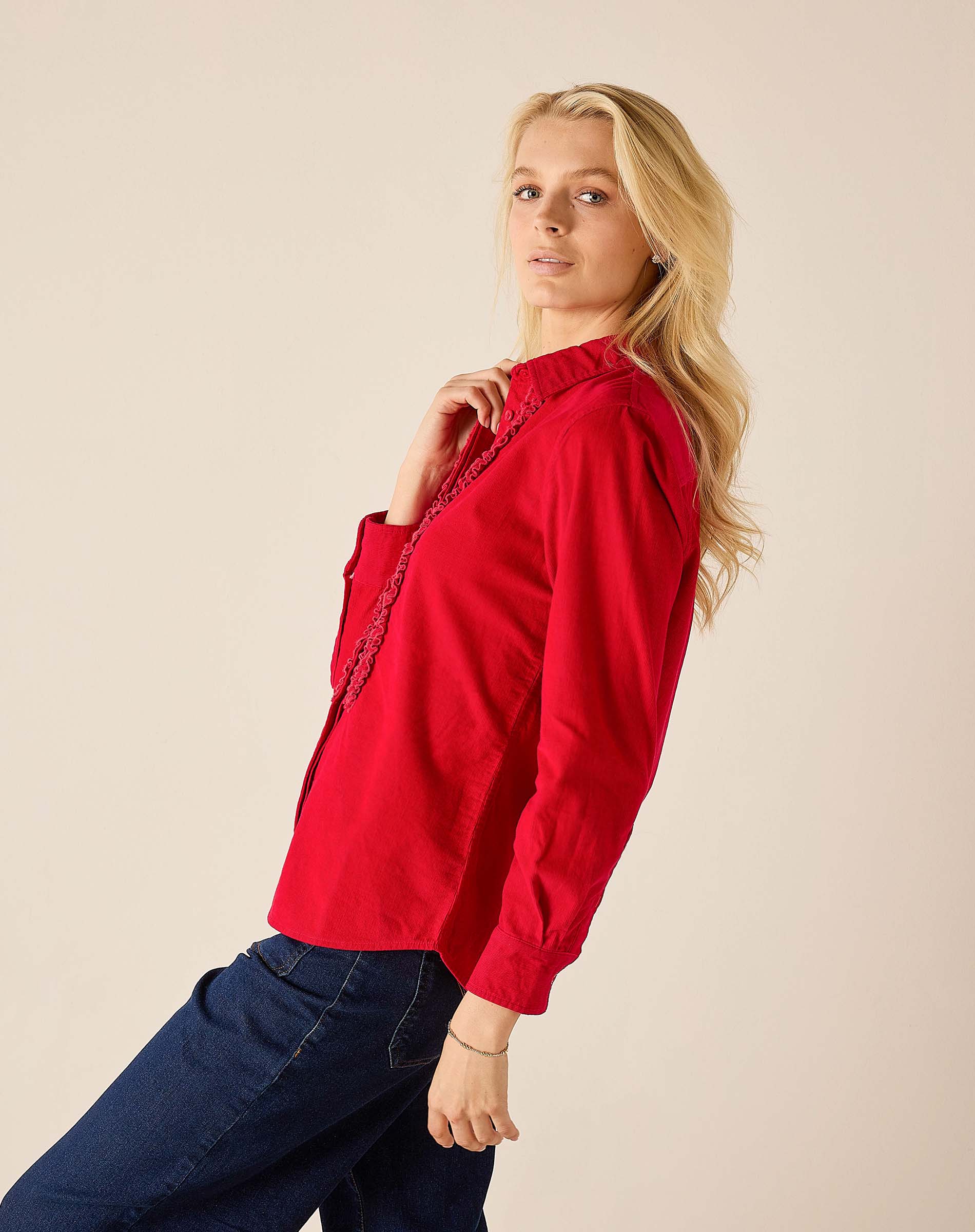 Cardinal red tuxedo ruffle shirt with a textured overlay on the front and gathered cuffs.