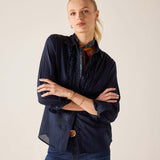 Navy blue ruffled tuxedo shirt with soft drape and elegant pleating details.