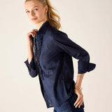Navy silk-finish blouse featuring a tuxedo ruffle detail and buttoned cuff.
