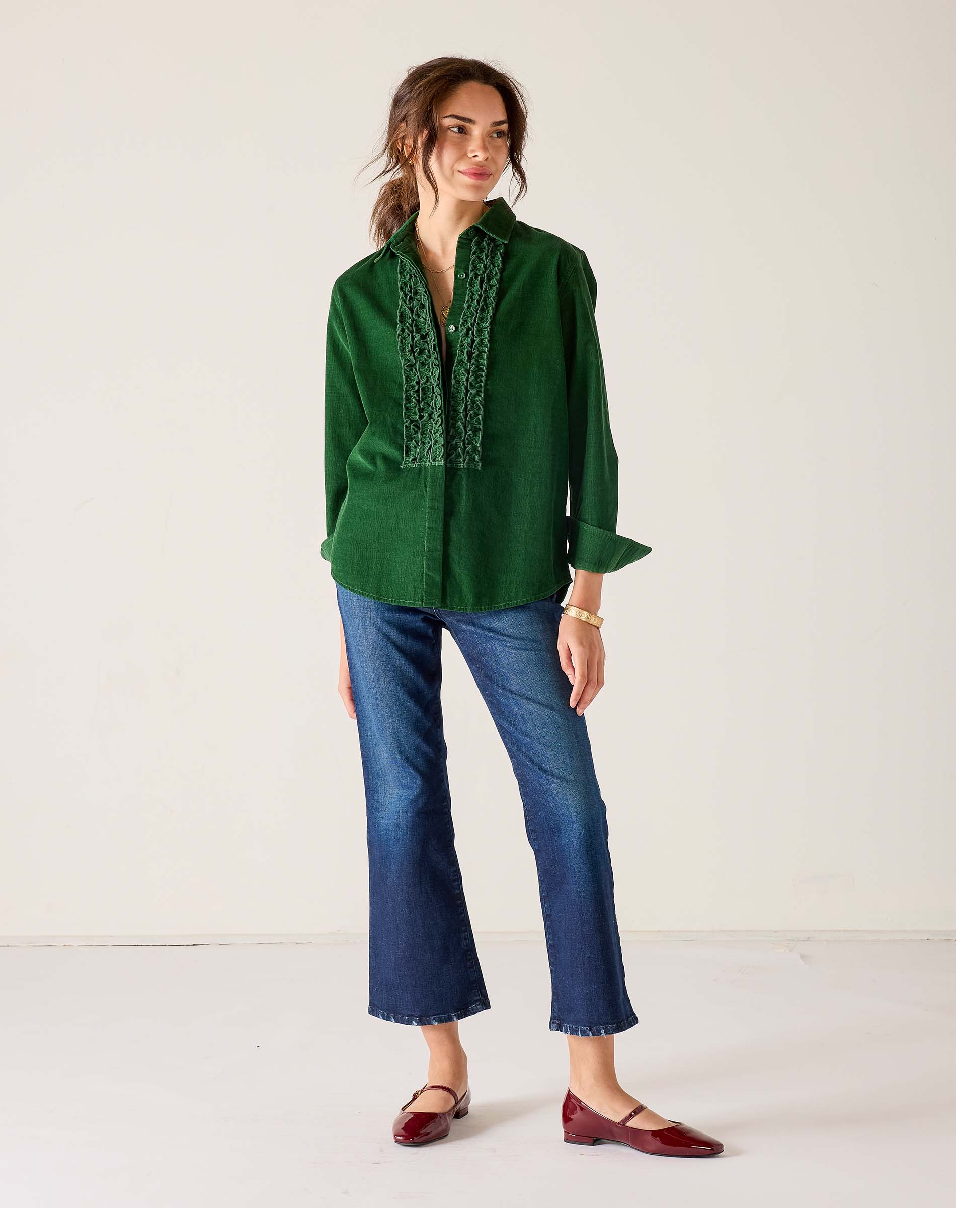 Ladies' travel-ready pine green tuxedo ruffle shirt with a button front and pleated detailing.