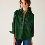 Pine green button-down shirt with ruffle details and long sleeves.