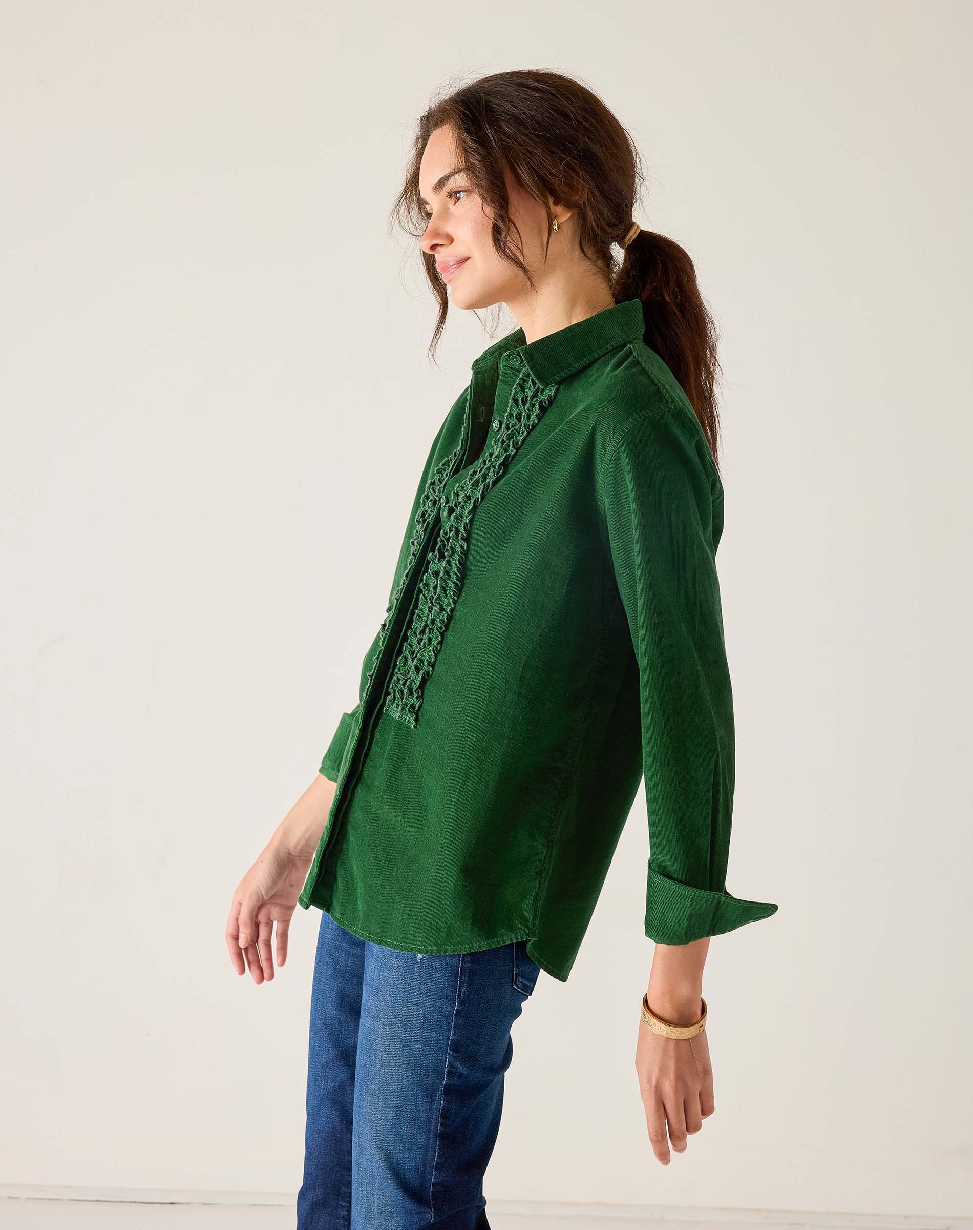 Pine green linen tuxedo shirt with ruffle detailing and 3/4 sleeves.