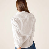 Back view of white tuxedo ruffle shirt for women's travel-friendly wear