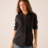 Black ruffled tuxedo top with button front and vertical lace detailing.