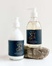 voyager shea lotion and hand soap laying on a white background