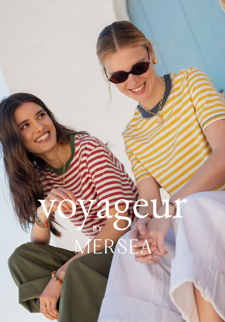MERSEA ladies' travel-ready striped shirts and linen pants worn by two models outdoors.