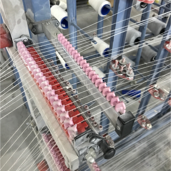 Factory Industrial Sewing Machine with pink yarn