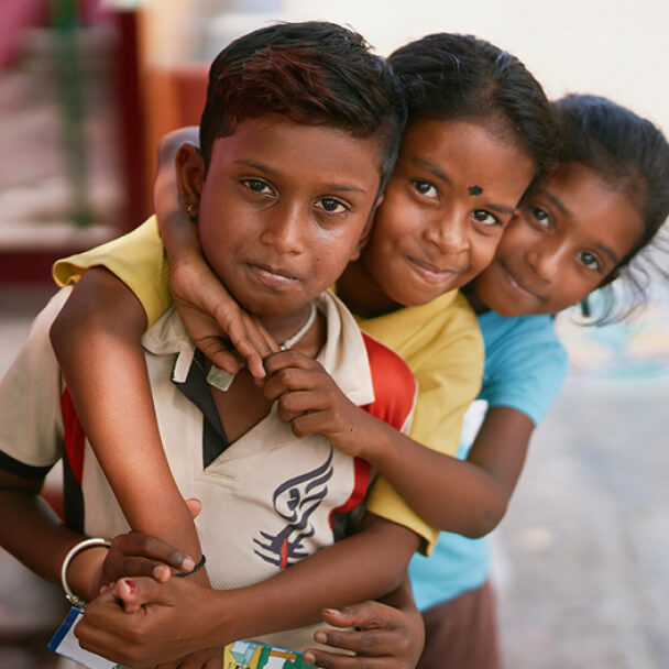 Three Indian Children with Arms Wrapped around Eachother