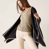 MERSEA ladies' travel-ready women's travel-friendly black and cream whipstitch travel wrap with a large rectangular drape.