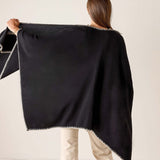 Back view of the black and cream whipstitch travel wrap.