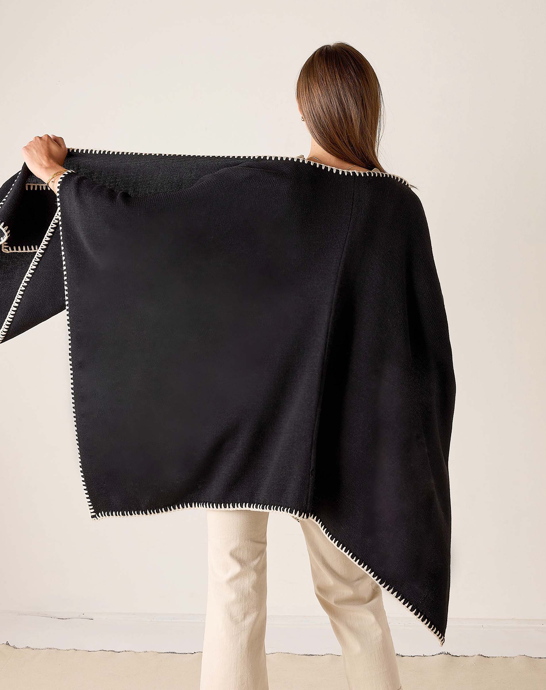 Back view of the black and cream whipstitch travel wrap.